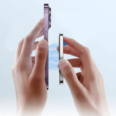 Two hands holding a futuristic phone and the Stravelle Selfie Monitor show how easy and powerful the magnetic feature is.